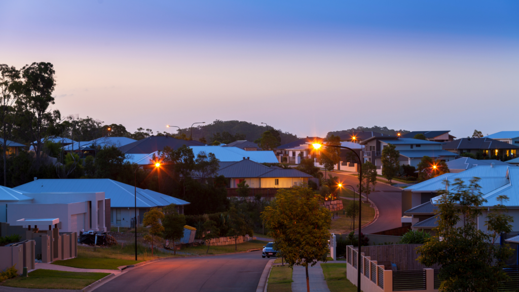 Investment Property vs. Owner-Occupied Properties - Image of street view in an Australian residential community where there are both investment property and onwer occupied properties