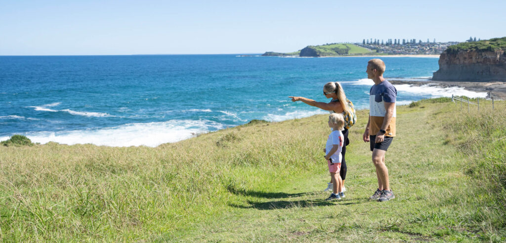 A small family is enjoying the coastal view in south coast nsw